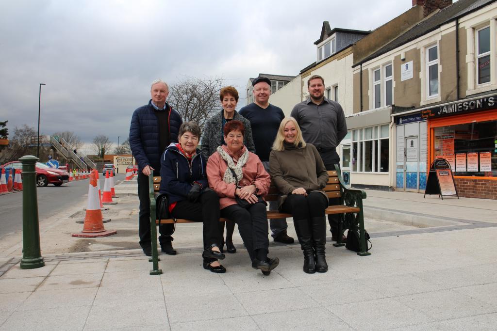 Residents sitting on a chair at the revamped area