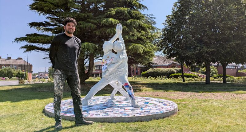 Artist Aaron Li-Hill with the Our Woven Voices artwork Artist Aaron Li-Hill with the Our Woven Voices artwork