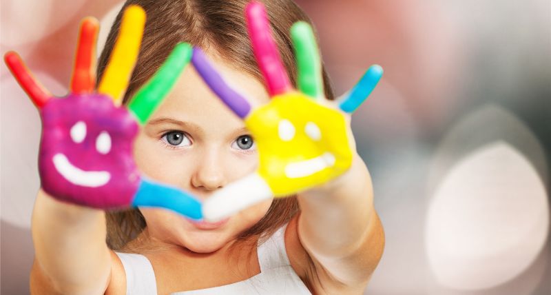 Young girl with painted hands 