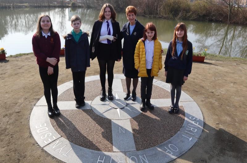 Elected Mayor and children at a memorial