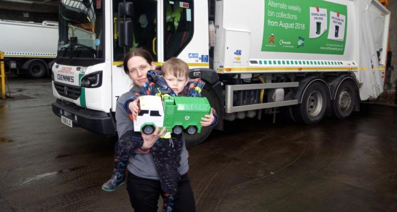 Axl and his mother pictured with a toy bin wagon