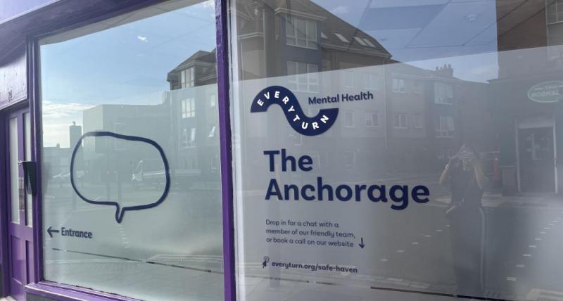 Picture of purple building with sign 'The Anchorage'