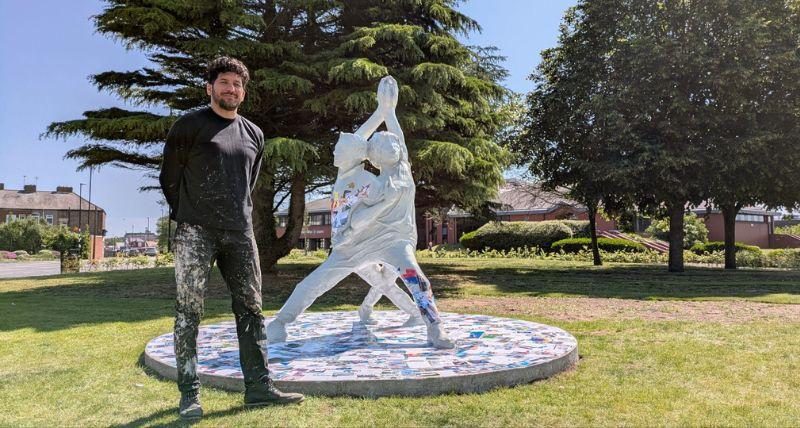 Artist Aaron Li-Hill with the Our Woven Voices artwork Artist Aaron Li-Hill with the Our Woven Voices artwork